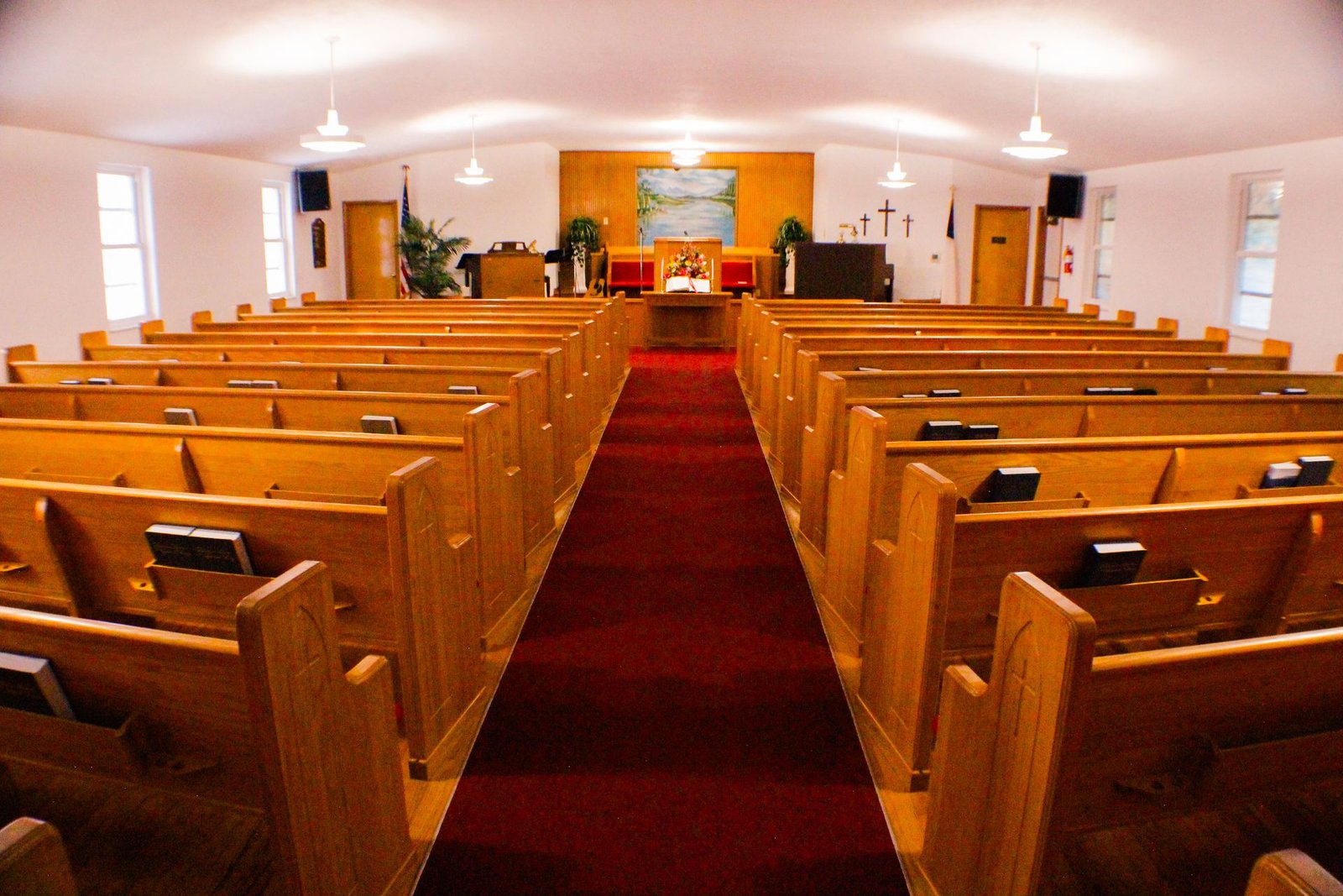 Church pew with a Bible resting on it